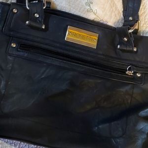 Black purse,3 large compartments , and multiple pockets inside/ out. Organizer